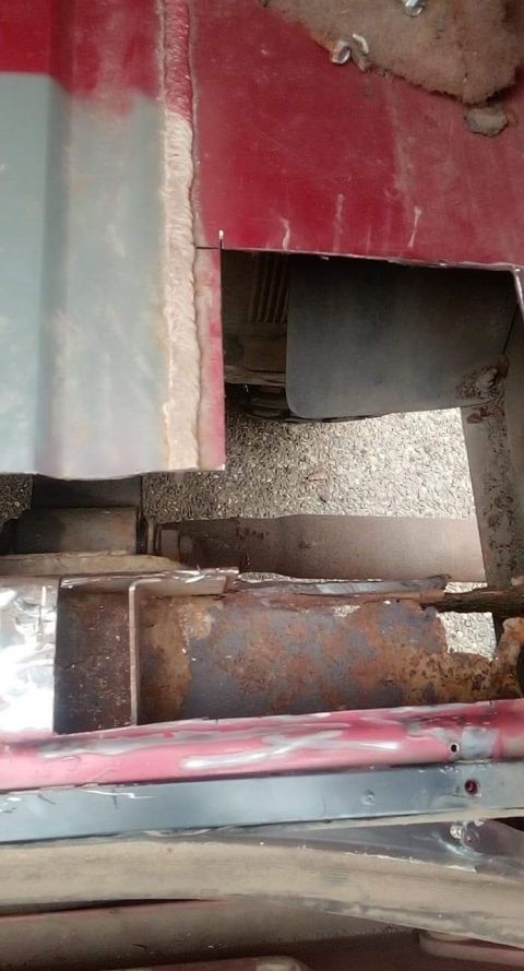 1994 Ford Bronco - Close-up view of heavily rusted metal frame and body panels, indicating significant repair work is needed.