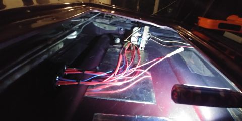1996 Ford Bronco - Exposed wiring and electrical components are visible inside a vehicle's interior.