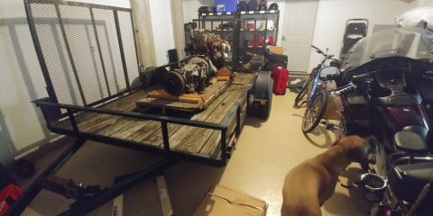 1996 Ford Bronco - Garage scene with a trailer, engine parts, motorcycles, and a bicycle.