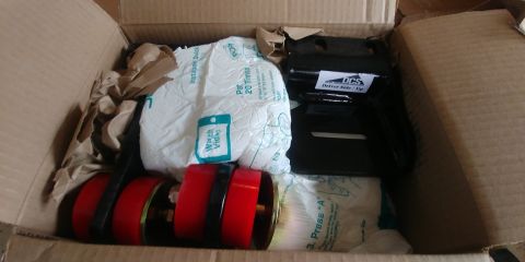 1996 Ford Bronco - New parts arrived in a cardboard box, ready for installation.