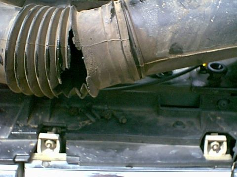 1988 Ford Bronco - A damaged air intake hose is shown, with no clear year identification.