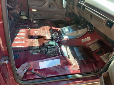 1996 Ford Bronco - Interior of a 1996 Ford Bronco, carpet removed to expose the floor pan and sound deadening.
