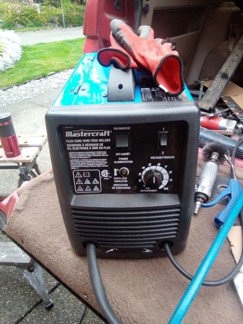 1994 Ford Bronco - A Mastercraft welder and tools are placed inside a vehicle, ready for use.