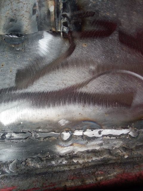 1994 Ford Bronco - Close-up view of welded metal sections, showing grinding marks and signs of wear.