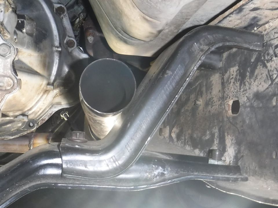 Can squeeze the right upper perch in, but it's too tight against the exhaust pipe to push it in enough to get the top bolts in.