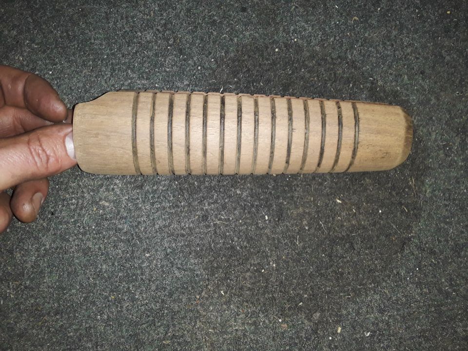 Wooden object with carved grooves