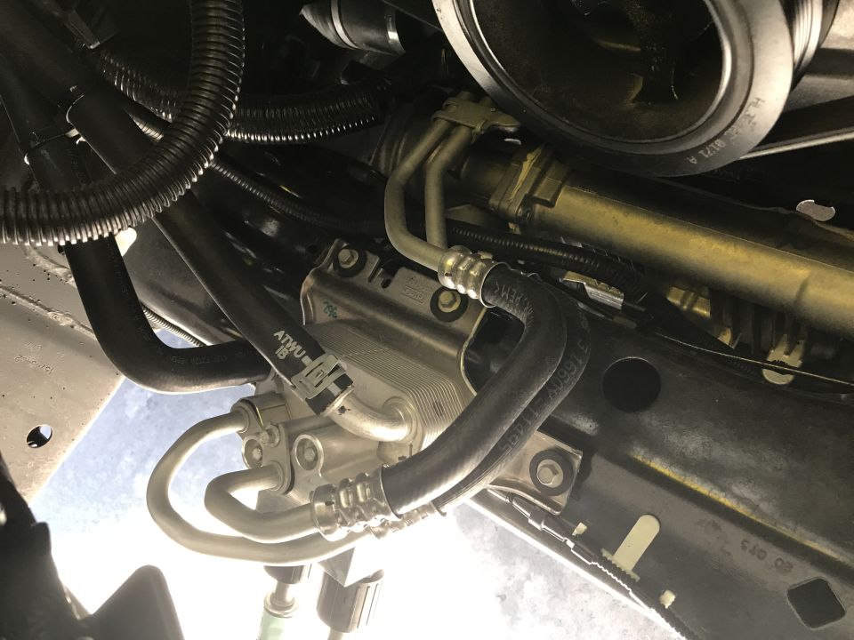 Engine oil cooler lines with ATWU 18 markings and Supermotors.net logo
