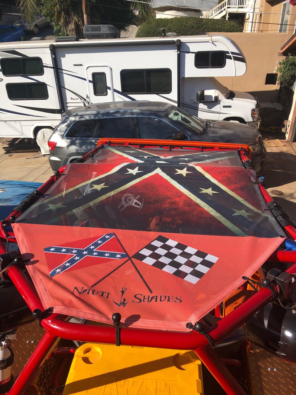 Red frame with Confederate and checkered flags and "NAUTI SHADES" text.