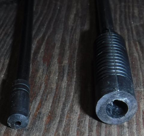 1992 Ford Bronco - Plastic hollowed out enough to form a cable stop.