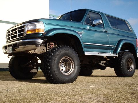 1996 Ford Bronco - This 1996 Ford Bronco features a significant lift kit and oversized off-road tires.