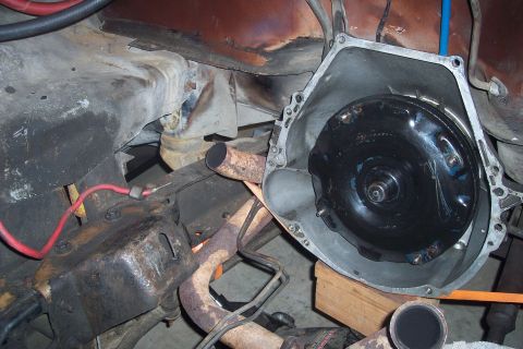 1978 Ford Bronco - A close-up view shows the torque converter installed inside the bell housing of an automatic transmission, likely from a classic vehicle. T…