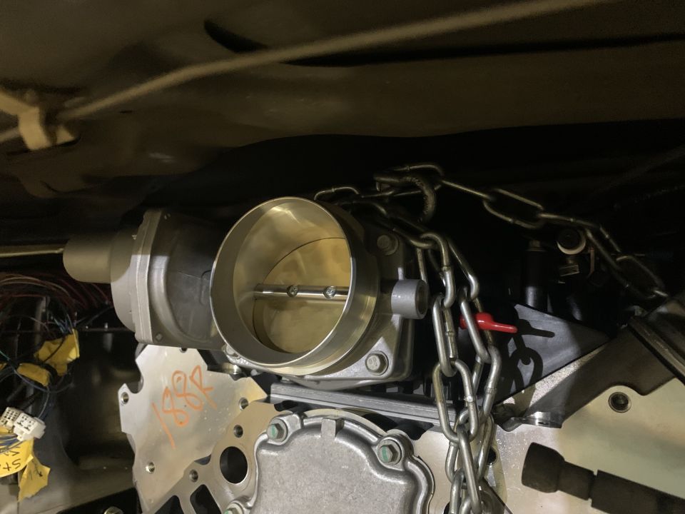 Throttle body and engine parts with chains attached