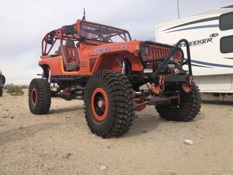 1992 Jeep Wrangler - Modified orange Jeep Wrangler with "GENERAL LEE" and "01" graphics sits in a desert landscape.