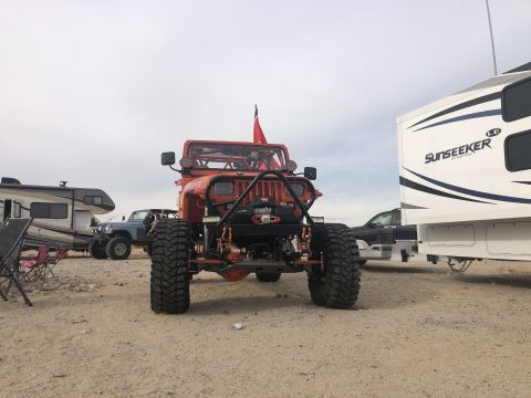 1992 Jeep Wrangler - This modified 1992 Jeep Wrangler is equipped with oversized tires and a front winch, ready for off-road adventures.