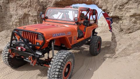 1992 Jeep Wrangler - This modified Jeep navigates a narrow passage in a desert landscape, displaying the name 'General Lee' and the number '01'.