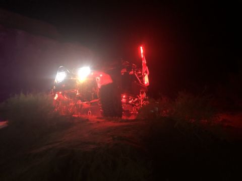 1992 Jeep Wrangler - An off-road vehicle is seen at night with its headlights and taillights illuminated, possibly during a shake-down run.