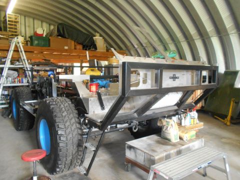1992 Ford Bronco - This custom-built vehicle chassis is in a workshop, lacking any identifiable year or model markings.