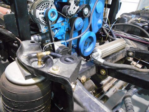 1992 Ford Bronco - Close-up of engine parts and an air suspension bag, with a watermark for Supermotors.net.