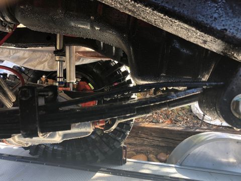 1992 Jeep Wrangler - Close-up view of a vehicle's suspension system and tire.