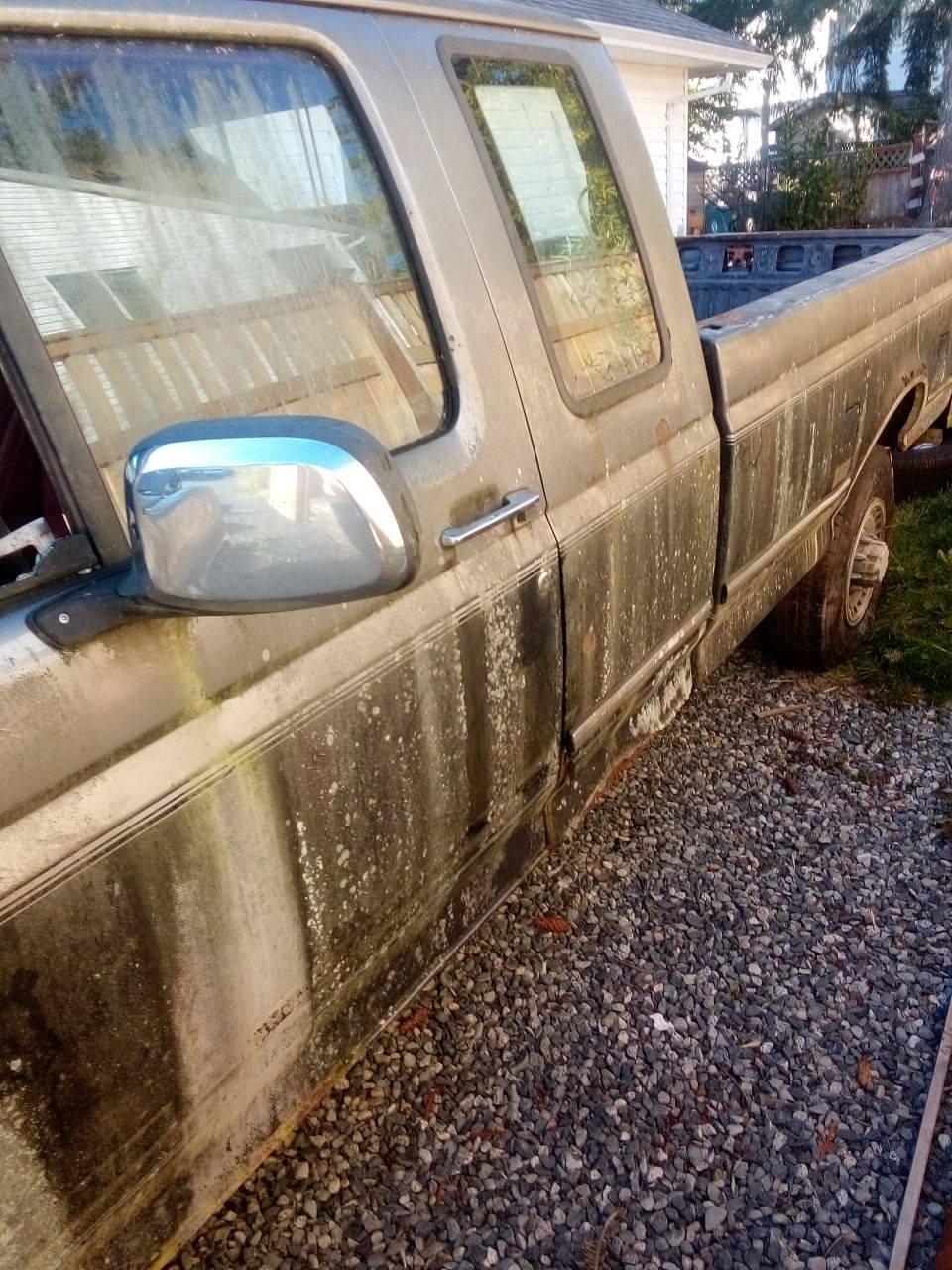 Dirty gray pickup truck side view