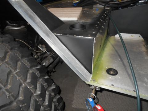 1992 Ford Bronco - Undercarriage detail showing a metal bracket and tire tread.