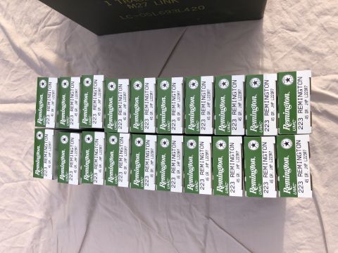 1995 Mercury Grand Marquis - Multiple boxes of Remington 223 ammunition are neatly arranged on a white surface.