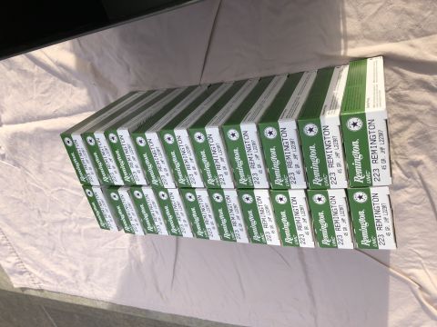 1995 Mercury Grand Marquis - Multiple boxes of Remington 223 ammunition are stacked on a white surface.