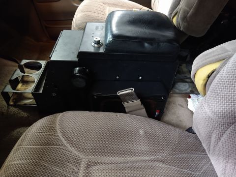 1996 Ford Bronco - This photo shows the interior of a vehicle, focusing on a custom center console unit.