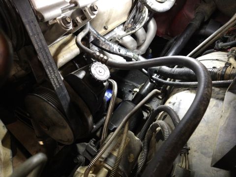 1996 Ford Bronco - Close-up view of an engine compartment, showing various mechanical components and wiring harnesses.