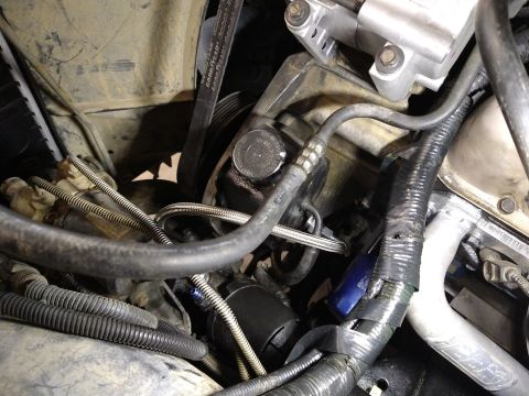 1996 Ford Bronco - Engine bay detail the power steering pump and associated plumbing.