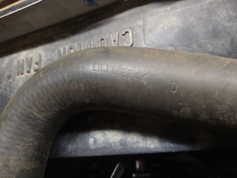 1996 Ford Bronco - Close-up of a rubber hose with embossed part number and identification markings.