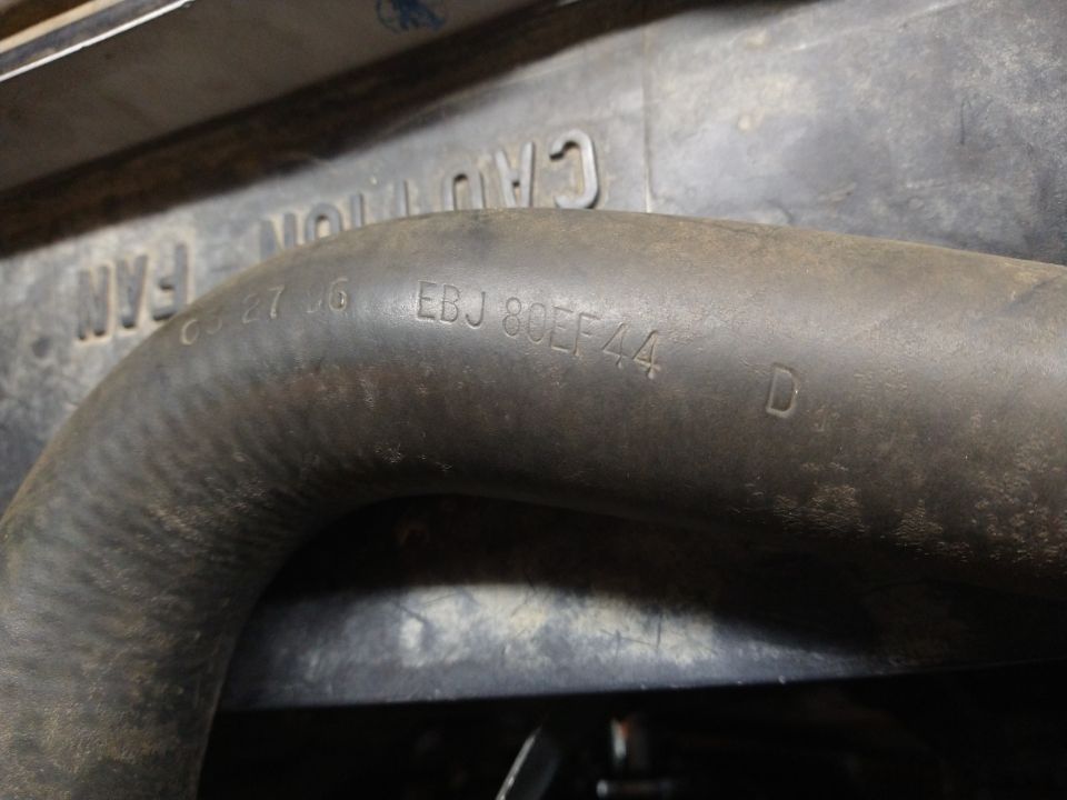 Engine hose with embossed text EBJ 80EF44 and D
