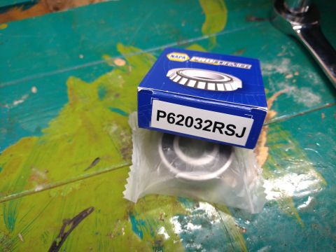 1996 Ford Bronco - A NAPA Proformer bearing labeled P62032RSJ is shown in its blue and white packaging. The bearing is partially visible through the clear pla…