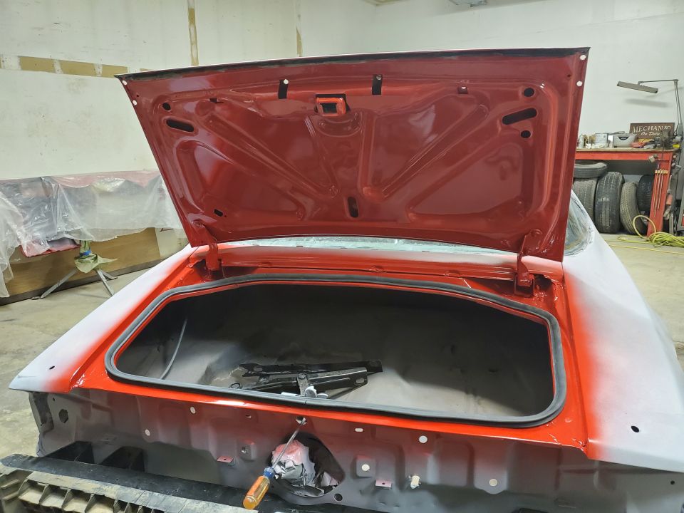 1979 Chevrolet Camaro trunk open, showing interior and jack