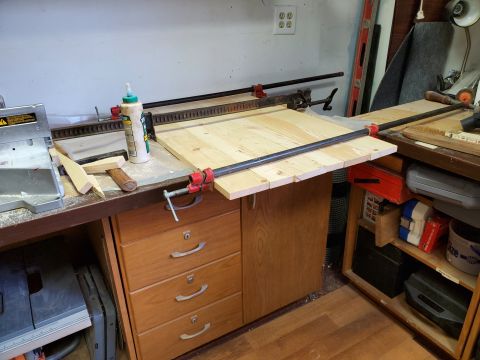 2004 Aston Martin Virage - Woodworking project in progress on a workbench with clamps and glue.