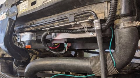 1995 Ford Bronco - This image shows the engine's cooling fan assembly and associated hoses, not the entire vehicle.
