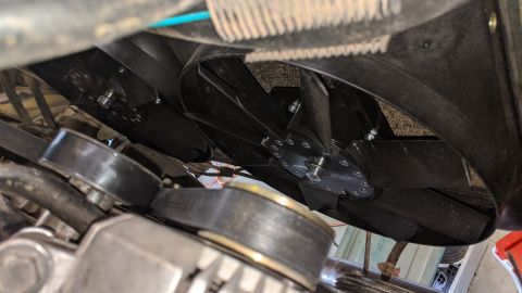 1995 Ford Bronco - Close-up view of engine cooling fans and associated belts.
