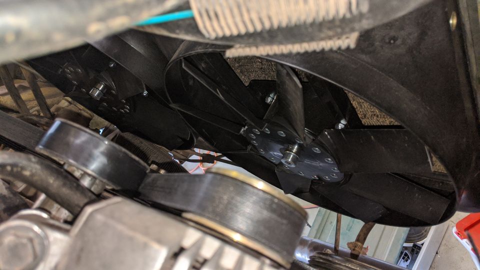 Engine cooling fans with visible belts and pulleys
