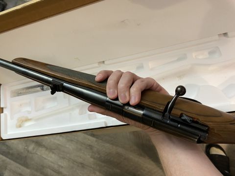 2011 Harley-Davidson Elec Gld Police - A person is holding a rifle with a wooden stock, which is placed inside a box with foam padding.