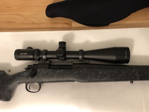 1995 Mercury Grand Marquis - Rifle with Vortex scope and black gun sock in background.