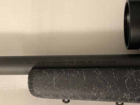1995 Mercury Grand Marquis - Close-up of a rifle barrel showing manufacturer markings and caliber information.