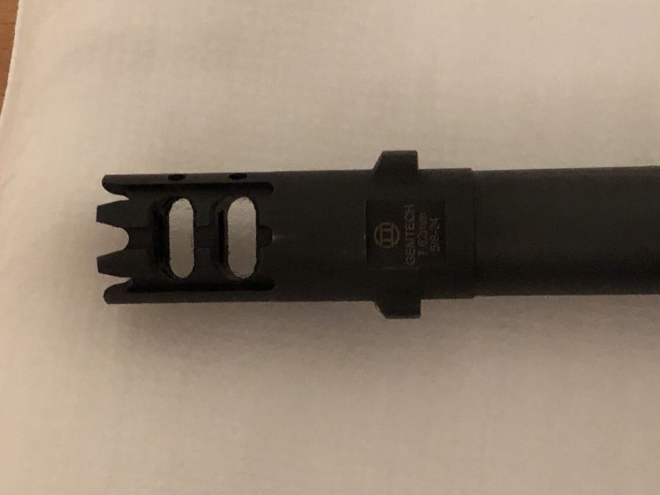 Black muzzle brake with text 'GEMTECH 7.62x39 5/8-24'