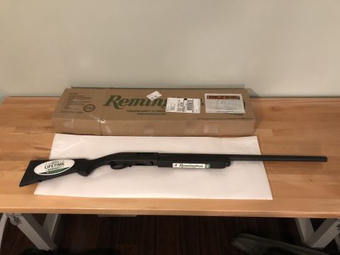 1995 Mercury Grand Marquis - A Remington shotgun and its packaging are displayed on a wooden surface.