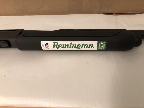 1995 Mercury Grand Marquis - A close-up view of a Remington shotgun barrel with branding visible.