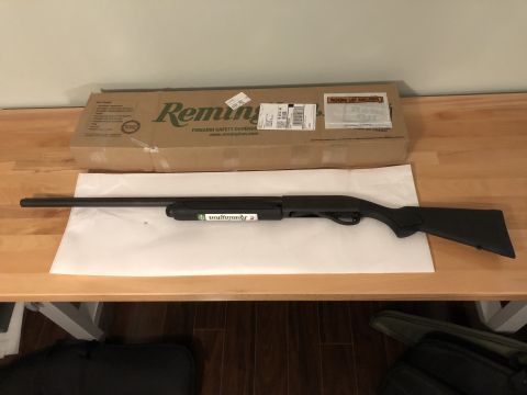1995 Mercury Grand Marquis - A Remington shotgun is displayed with its original box on a wooden table.