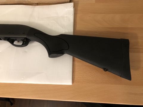 1995 Mercury Grand Marquis - Close-up of a black shotgun stock, showing the pistol grip and buttpad.