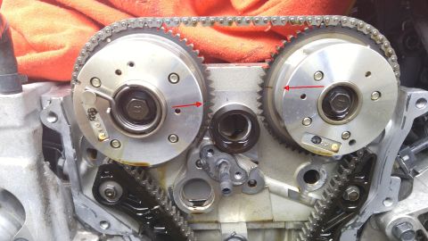 2010 Hyundai Genesis - This image shows the internal workings of an engine, specifically the timing chain and sprockets.