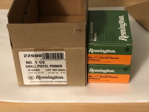 1995 Mercury Grand Marquis - A box of Remington small pistol primers sits next to two stacked boxes of the same ammunition component.