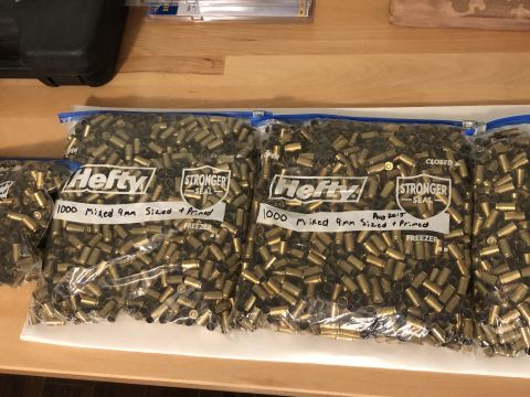 1995 Mercury Grand Marquis - Several bags filled with 9mm shell casings are visible, with labels indicating they contain 1000 mixed, sized, and primed casings.
