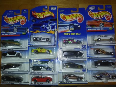 1989 Ford F-350 - A variety of Hot Wheels toy cars are displayed in their original packaging.